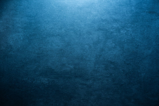 blue grunge stone background texture with radial gradient and copy space