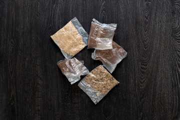 a view from above of several rice and other porridge in quick cooking plastic bags package