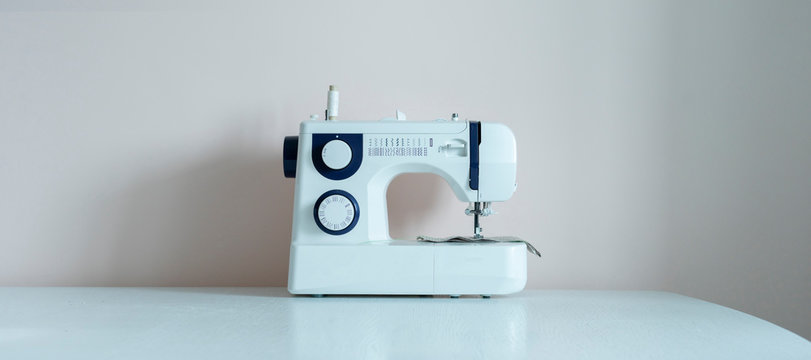 A Simple Sewing Machine On The Shelf Against The Wall Isolated, Home Supplies Wide Long Banner