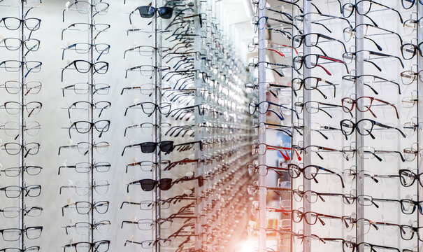 Showcase with spectacles in modern ophthalmic store. Closeup.