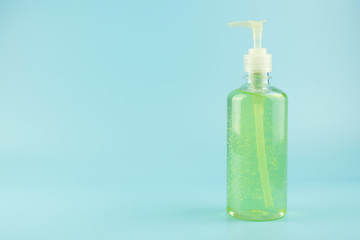 wash hand sanitizer gel bottle on blue background, against Novel coronavirus or Corona Virus Disease (Covid-19). Antiseptic, Hygiene and Healthcare concept