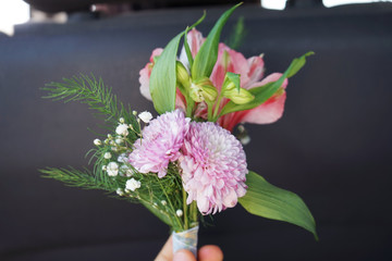 bouquet of flowers in hand
