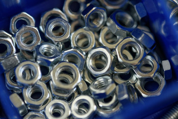 Factory equipment and industrial concept. macro view of Pile of internal screws, background or texture. stainless steel Female screw.