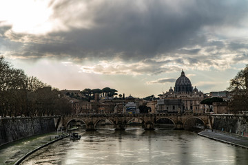 The Papal Basilica of St. Peter, west of River Tiber in Rome, Italy cloud day