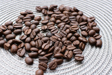 Colombian coffee beans, displayed in containers on black background