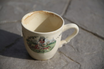 Dirty empty alsatian coffee cup