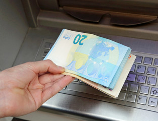boy takes banknotes euro with hand