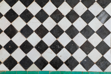Black and white ceramic tiles in checkerboard pattern