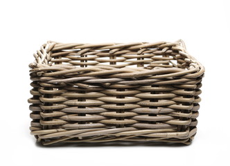 Empty wooden wicker basket isolated on white background