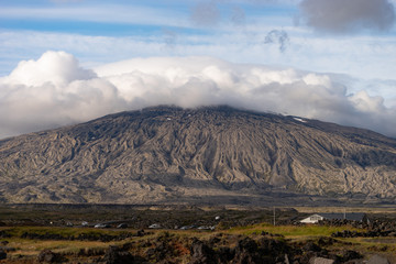 mountain of Snaefellsjokull National Park with white cloudy cap on peak. Iceland