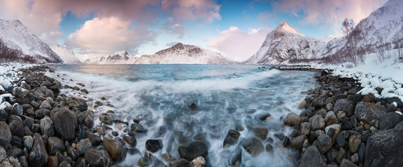 Panorama of snowy fjords and mountain range, Senja, Norway Amazing Norway nature seascape popular tourist attraction. Best famous travel locations. beautiful sunset within the amazing winter landscape © Michal