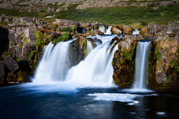Iceland waterfall closeup view of the gods cliff with long exposure smooth motion of water in...