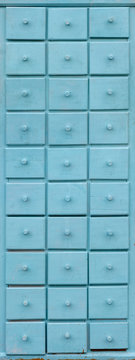 Blue wooden closet with drawers