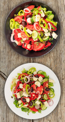 Greek salad with fresh vegetables and feta cheese background texture.