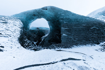 Entrance of an ice cave inside Vatnajokull glacier in southern Iceland. Amazing Iceland nature seascape popular tourist attraction. Best famouse travel locations. Scenic Image of southern Iceland