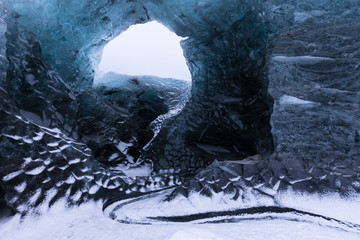 Entrance of an ice cave inside Vatnajokull glacier in southern Iceland. Amazing Iceland nature...