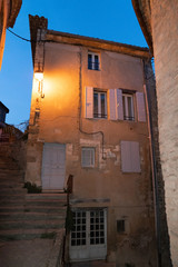 Old house building door street village Gordes town at night in Provence France