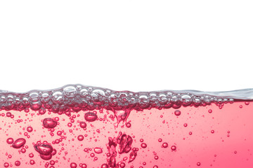 Close up water bubbles underwater on white background.Red bubbles on white.