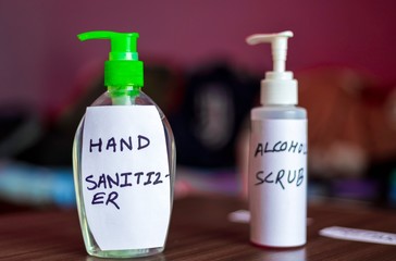 Hand Sanitizer and Alcohol Scrub Placed Next To Each Other