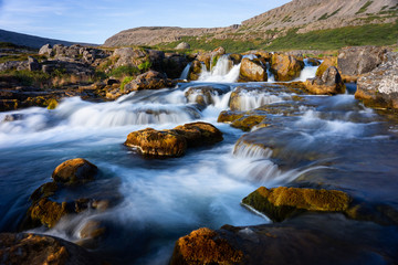 Iceland waterfall closeup view of the gods cliff with long exposure smooth motion of water in...