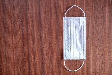 Surgical Paper Mask. Disposable Paper Mask Placed On The Table \