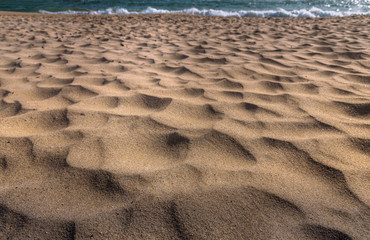 closeup of sand pattern of a beach in the summer