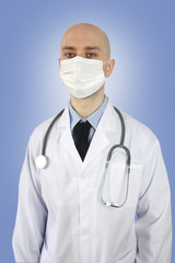 doctor in white uniform with a stethoscope in a protective mask and glasses, concept of medical care in the country, insurance, treatment