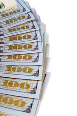 the hundred dollar bills are fanned out isolated on white