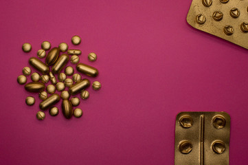 group of pills and blisters on pink background - 328932747