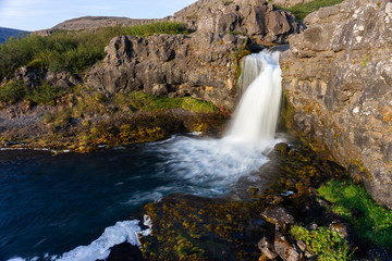 Iceland waterfall closeup view of the gods cliff with long exposure smooth motion of water in...