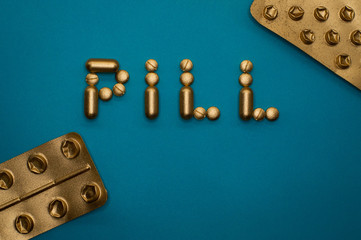 pill word and blisters on blue background - 328932964