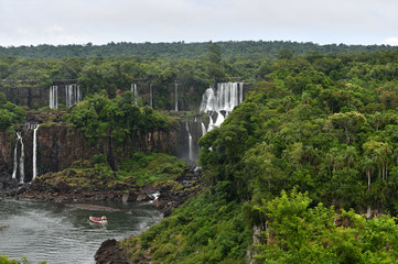 mesmerizing Iguazu Falls against the backdrop of the jungle and golkboy sky