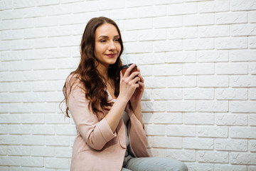 Portrait of happy businesswoman holding digital tablet in office, drinking coffee © ostap_davydiak
