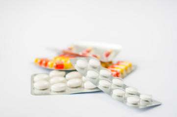 Closeup colorful antibiotics capsule pills in blister pack Pharmacy background. Antimicrobial drug resistance. Pharmaceutical industry. Global healthcare.