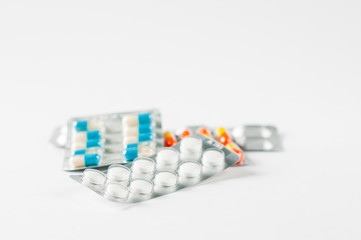 Closeup colorful antibiotics capsule pills in blister pack Pharmacy background. Antimicrobial drug resistance. Pharmaceutical industry. Global healthcare.