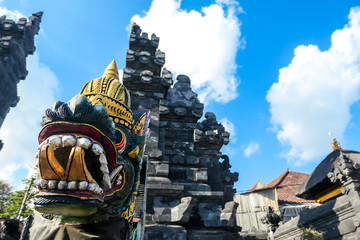 A colourful dragon wearing a crown at entrance gate to Tanah Lot temple on Bali, Indonesia. Traditional Hindu temple. Cultural and historical site. The dragon guards the entrance to the temple.