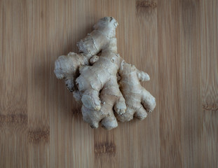 Ginger root on wooden table, high resolution photo