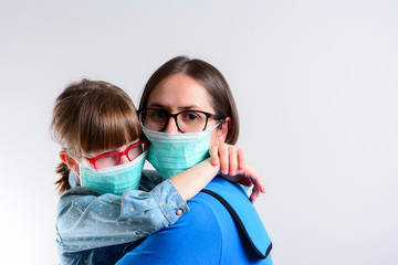 Family with kids in face mask in shopping mall or airport. Mother and child wear facemask during coronavirus and flu outbreak. Virus and illness protection, minimize risk of viral transmission