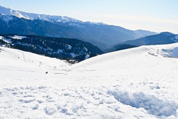 Fototapeta na wymiar top view of a high mountain gorge with snowy ridges