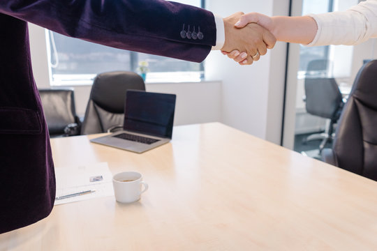 Firm handshake at the end of the successful job interview