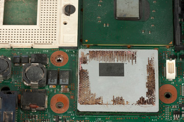 Close up empty socket for CPU and  integrated graphics card on laptop main board on white...