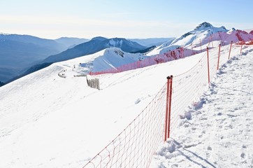  top view of a high mountain gorge with snowy ridges