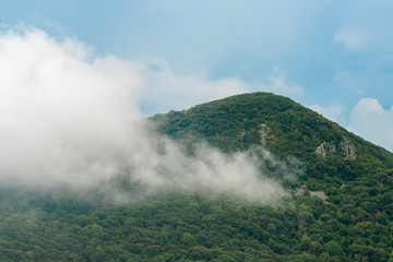 cloud passing a mountain top