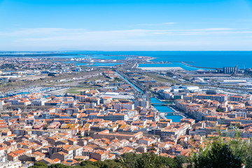 Fototapeta na wymiar Sète in France, aerial panorama, the harbor and the city with typical tiles roofs