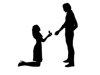 Silhouette of woman on her knees proposes marry man