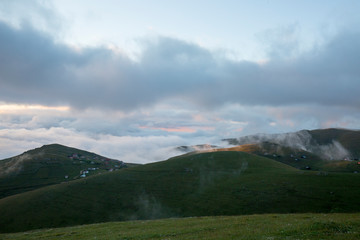 Fototapeta premium green lawns and mountains in fog trabzon turkey