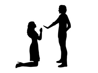 Silhouette of woman beg on her knees in front of man