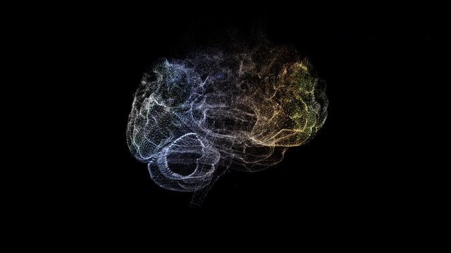 Abstract human brain from glittering particles floating and exploding on a black background.