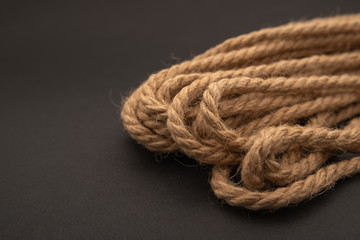 brown thick rope, rope on black background