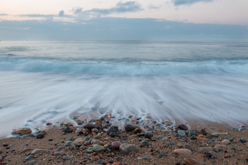 withdrawal of the wave from the beach